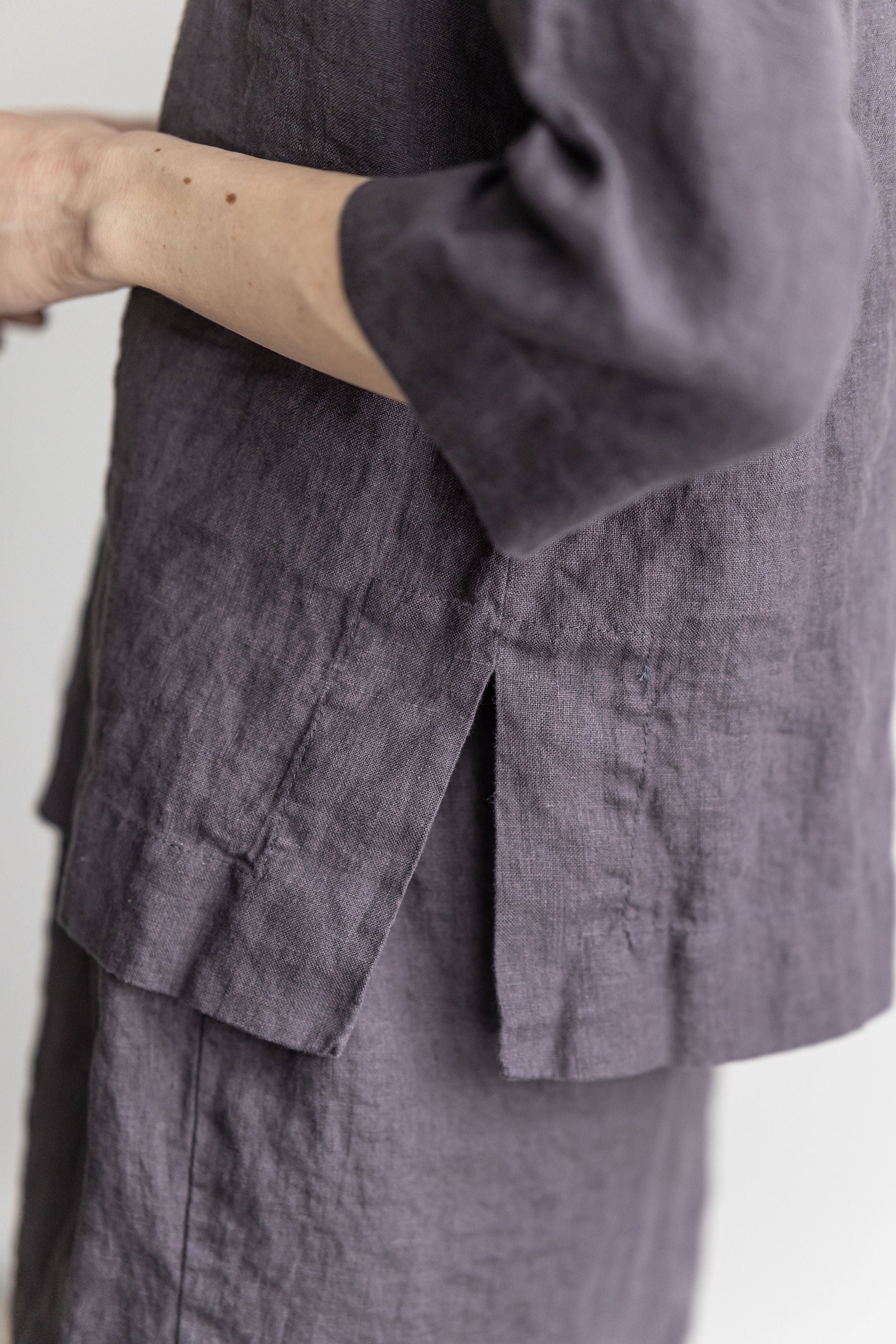 Classic linen blouse in a dark aubergine color.